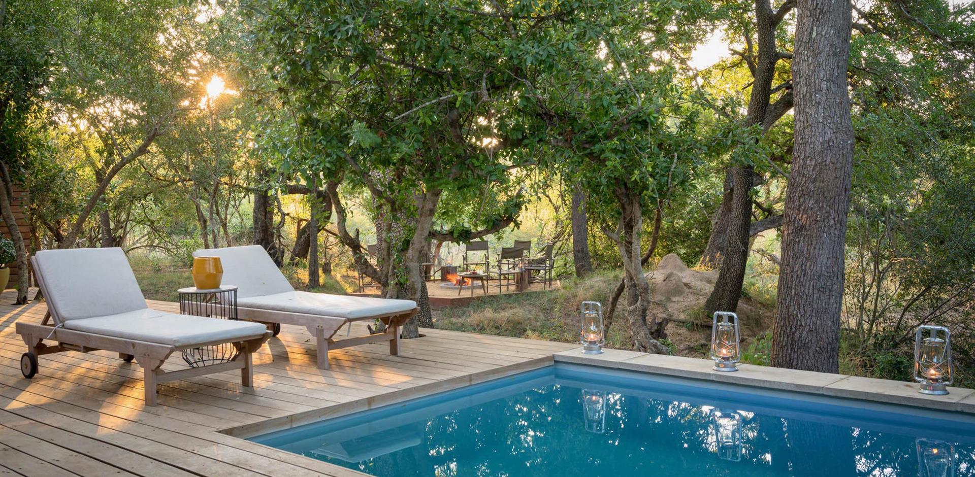 Pool loungers, Waterside at Royal Malewane, Greater Kruger National Park. South Africa