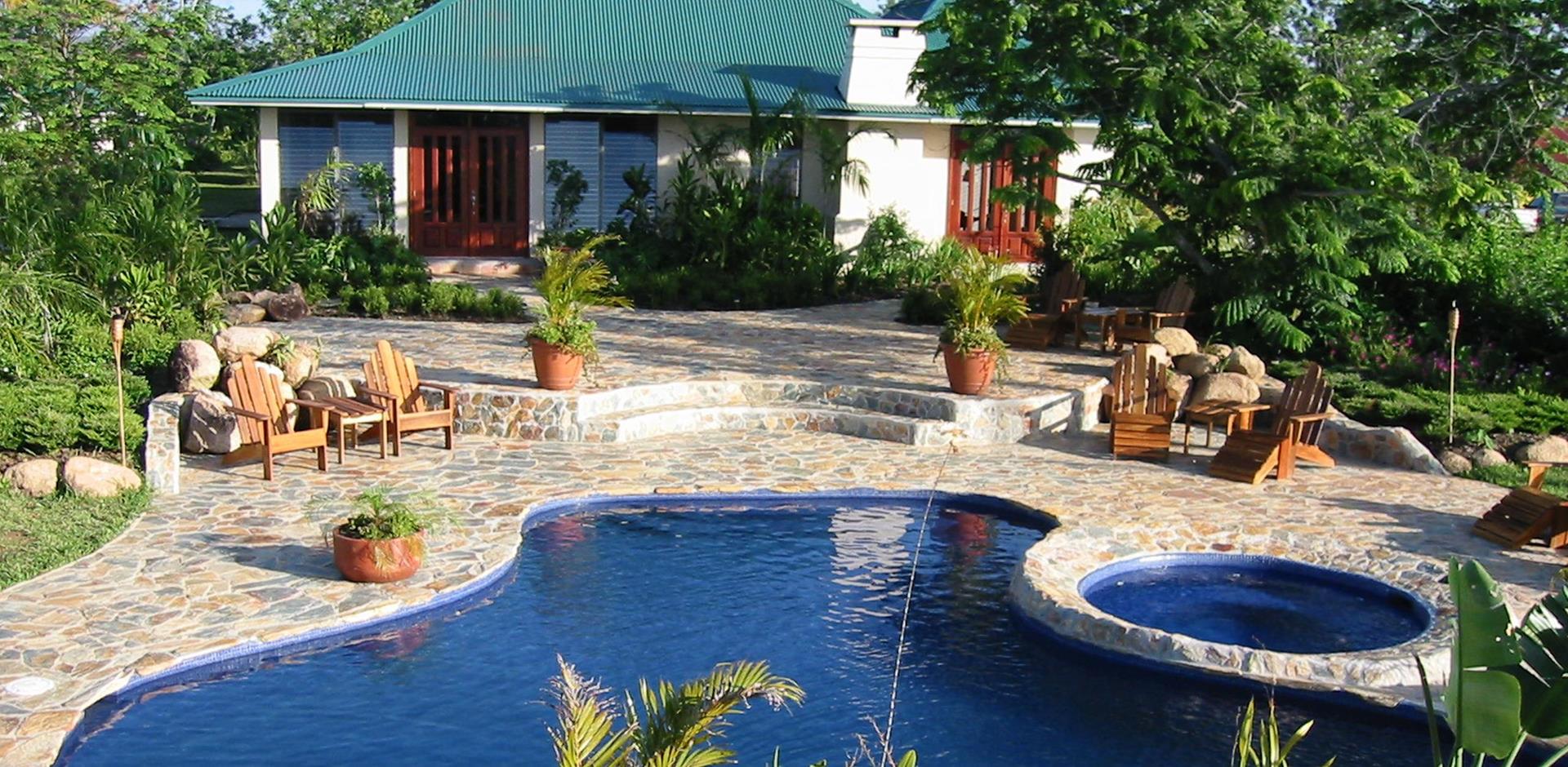 Outdoor seating area near pools, Hidden Valley Inn, Mountain Pine Ridge, Belize, Central America