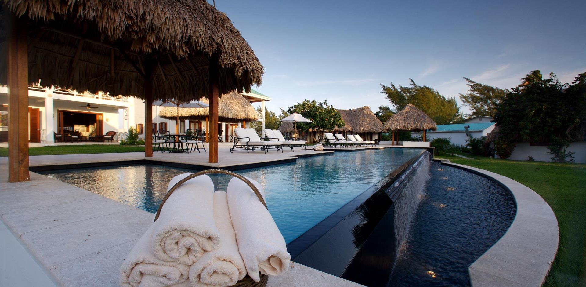 Outdoor seating area and pool, Victoria House Resort & Spa, The Cayes, Belize, Central America