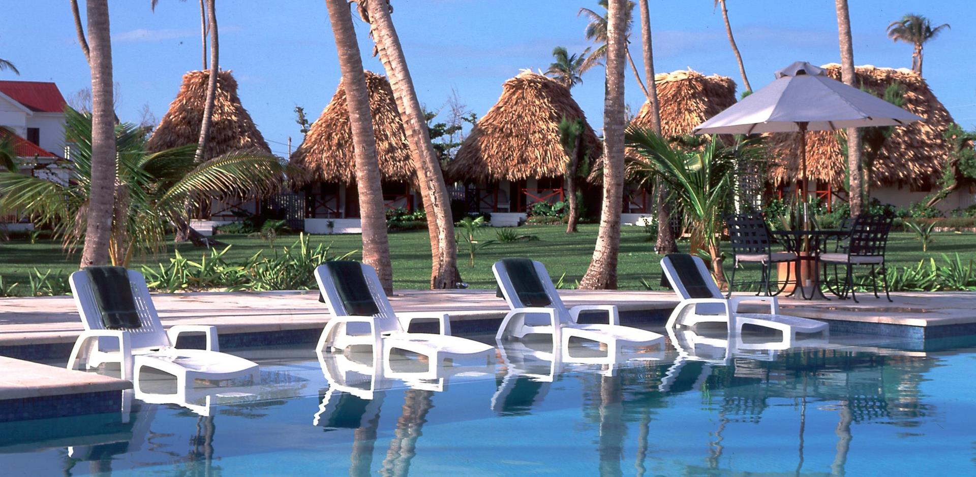 Sun loungers and pool, Victoria House Resort & Spa, The Cayes, Belize, Central America