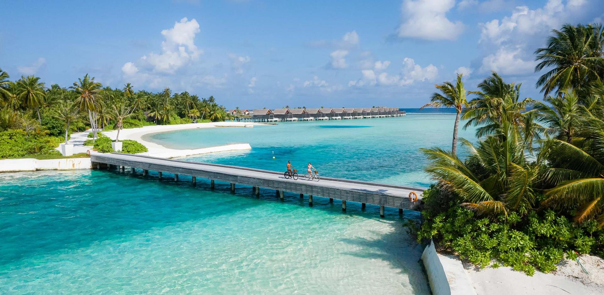 Bridge with cyclists, Niyama Private Islands, Maldives
