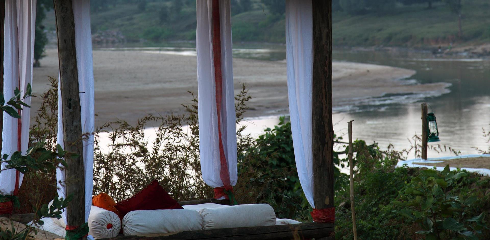 Outdoor bed, Flame of the Forest Safari Lodge, Kanha National Park, India