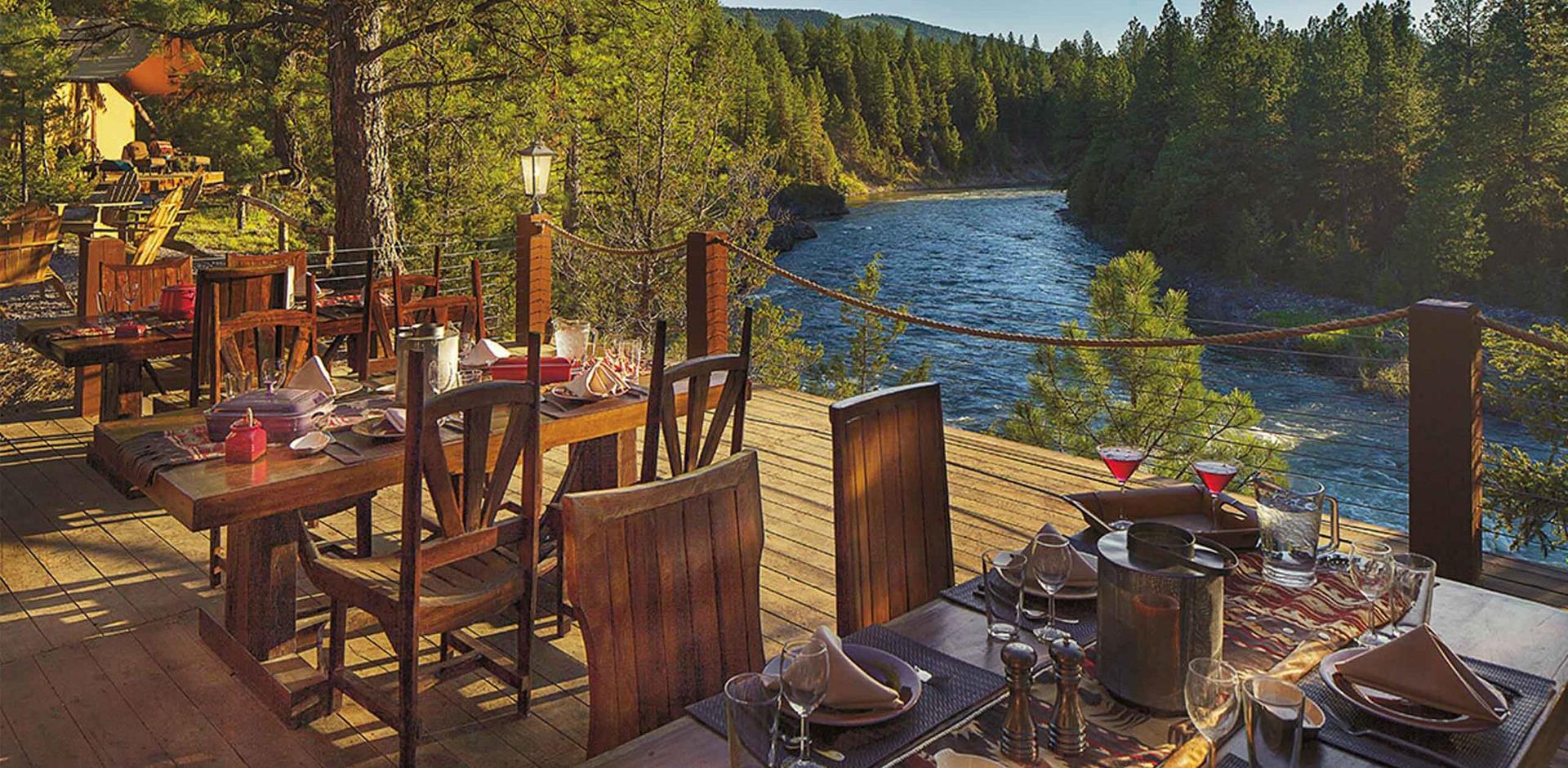 Cliffside camp restaurant with river view, The Resort at Paws Up, Colorado, USA