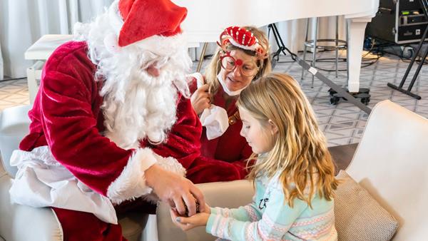 Santa Claus distributing presents