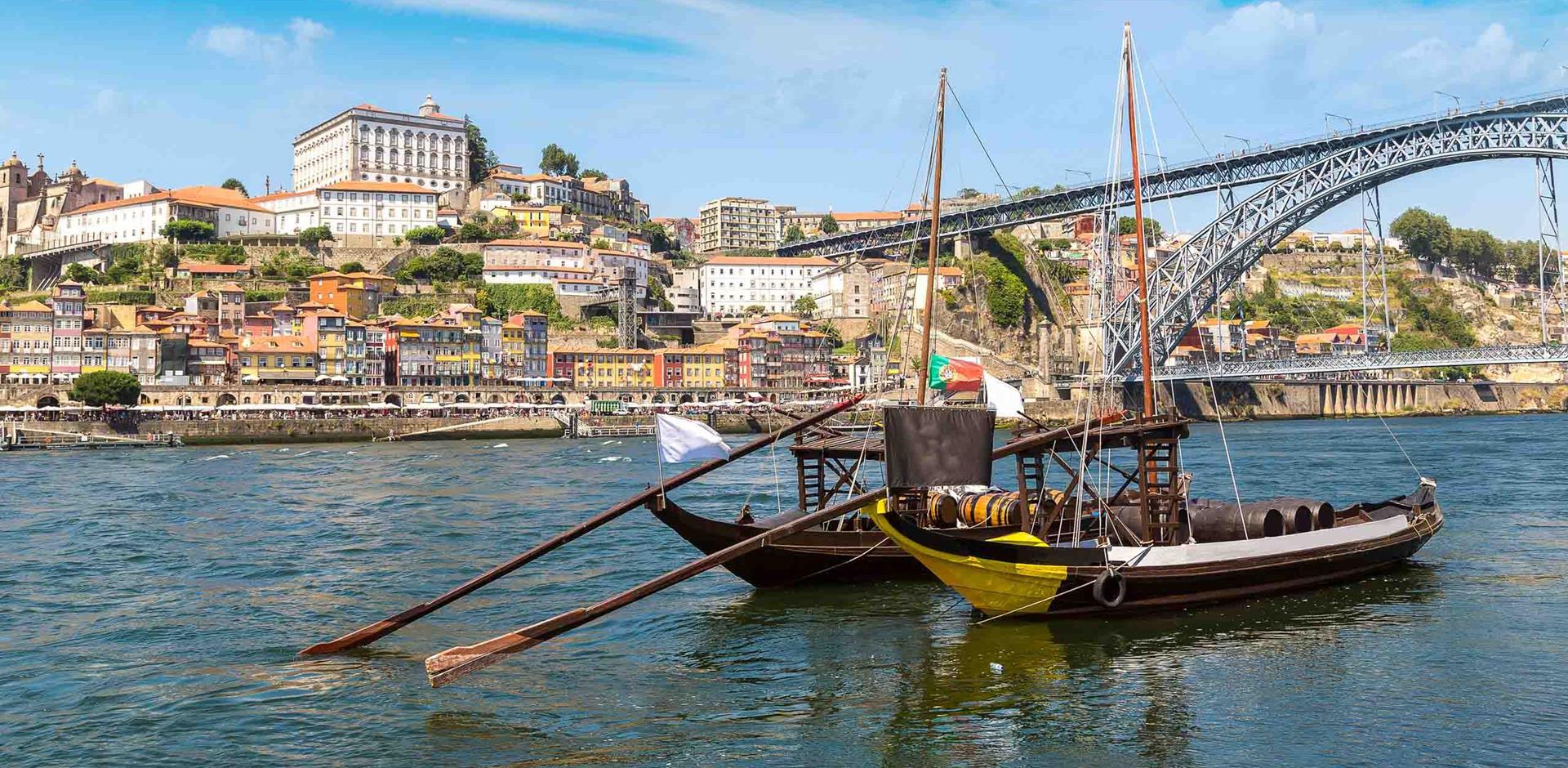 Boats with barrels on the Douro River in Porto, Portugal, Europe